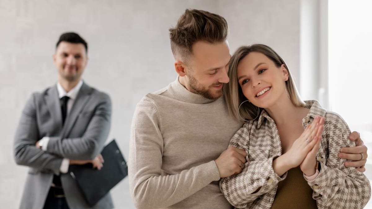 Real estate agent meeting a couple of homebuyers