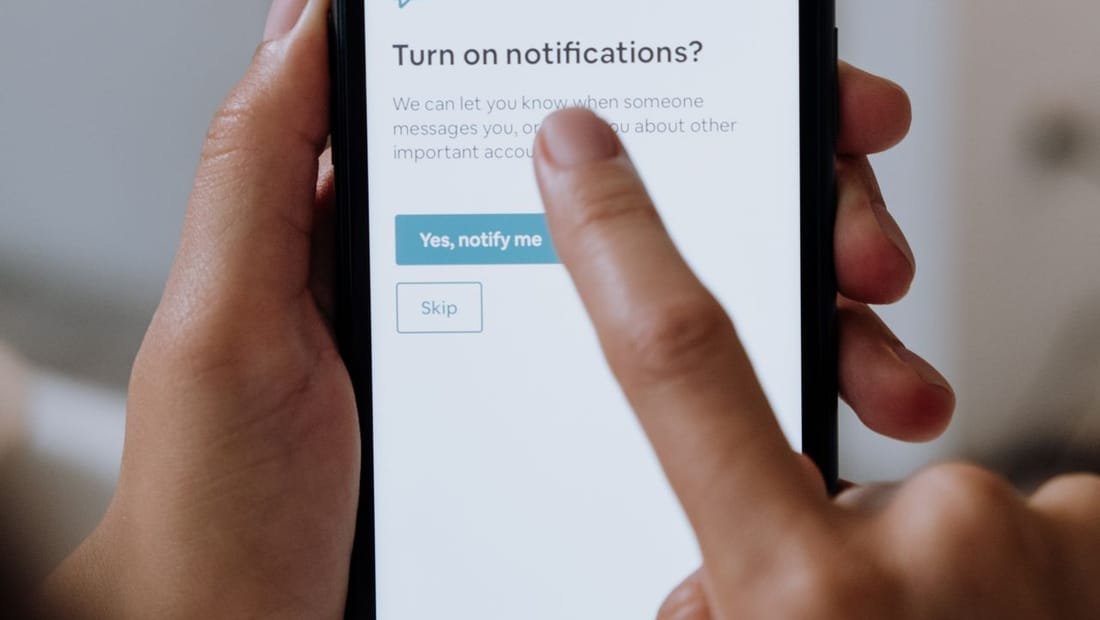 Real estate website search shown on a mobile phone