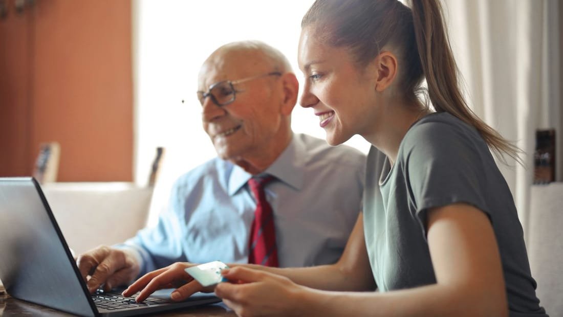 Two people reviewing documents together