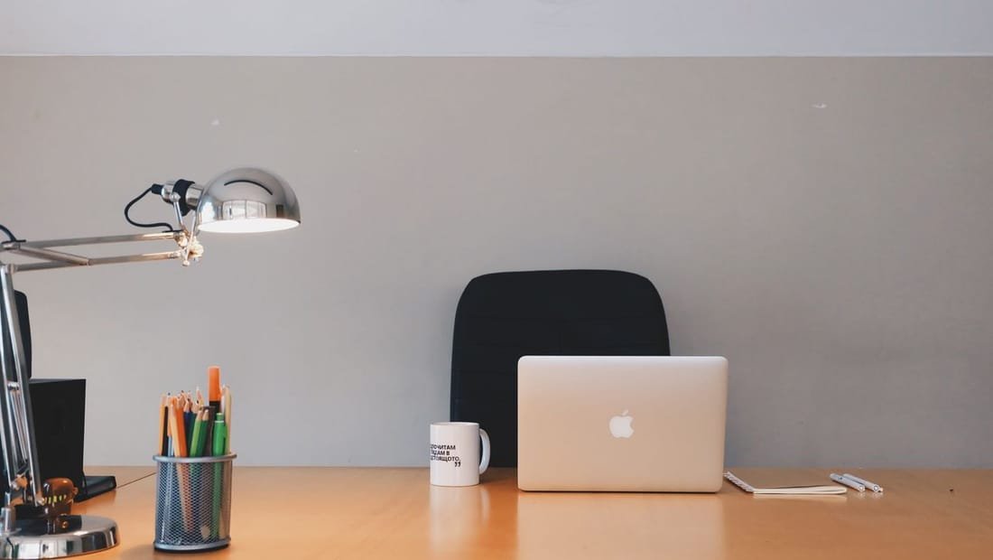 Minimal laptop workspace for designing a homepage