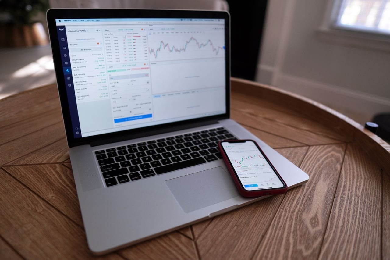 Modern real estate website shown on a laptop and phone